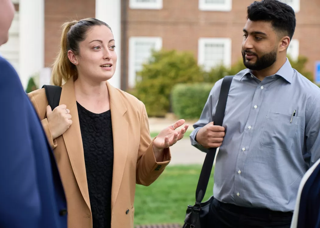 Law students talking in the courtyard of the Brandeis School of Law.