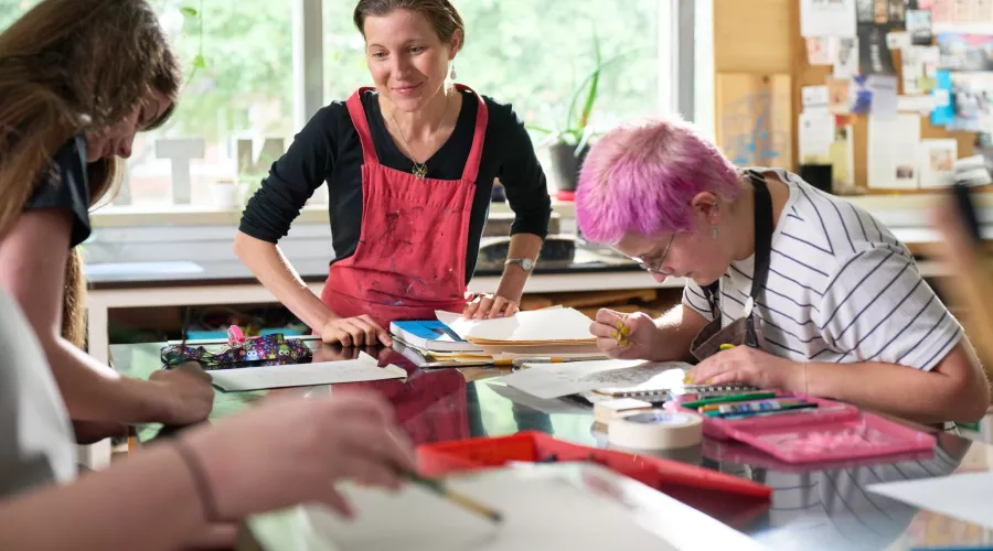 Rachel Singel, Associate Professor teaching a printmaking studio course
