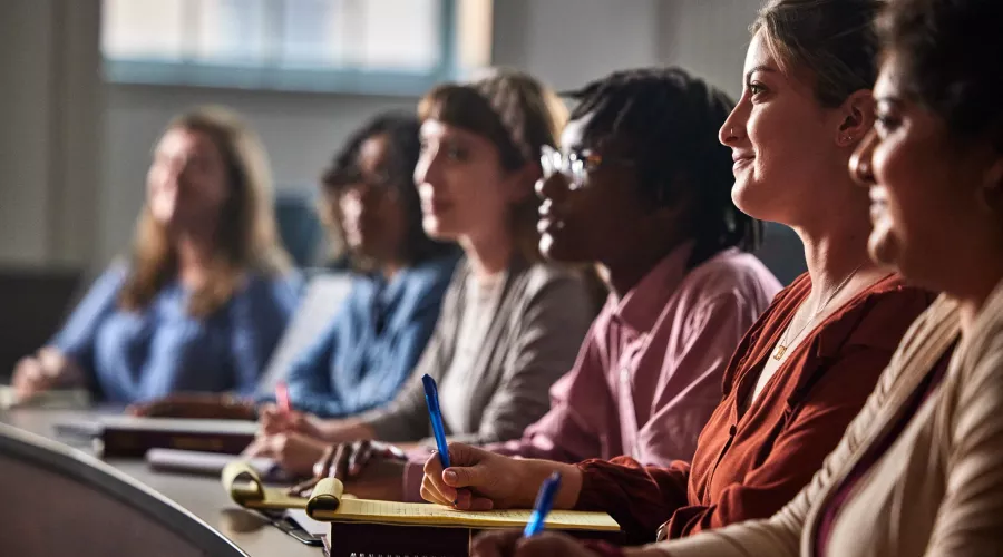Multiple law students listen to a lecture