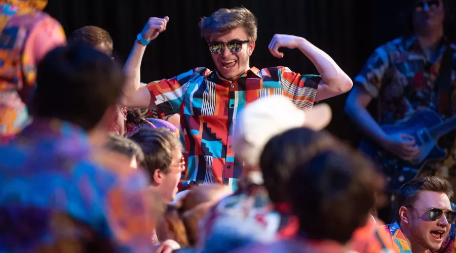 Students performing at the 2022 Fryberger Sing event at the Louisville Palace Theatre.